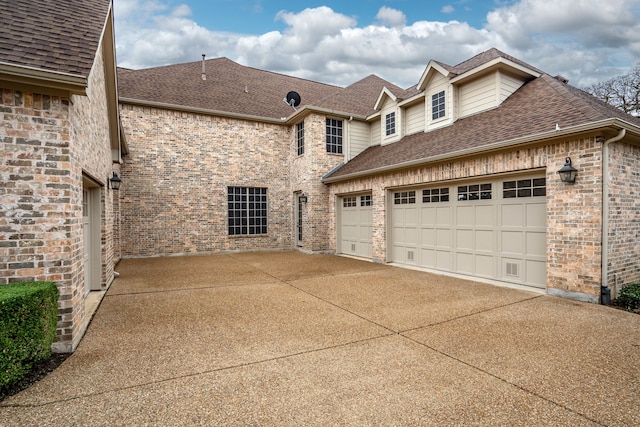 view of side of property featuring a garage