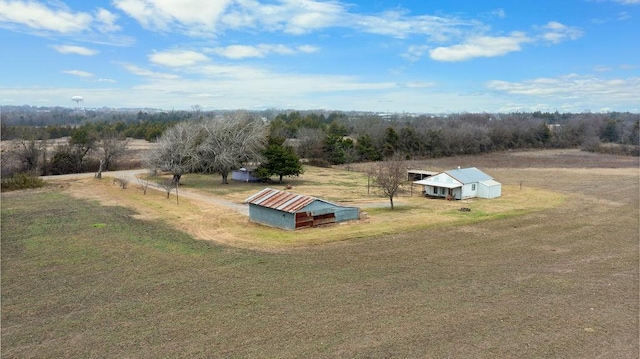 birds eye view of property with a rural view