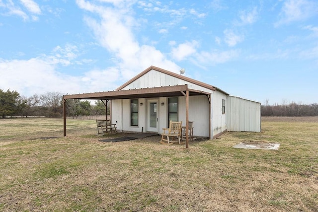 rear view of house with a lawn