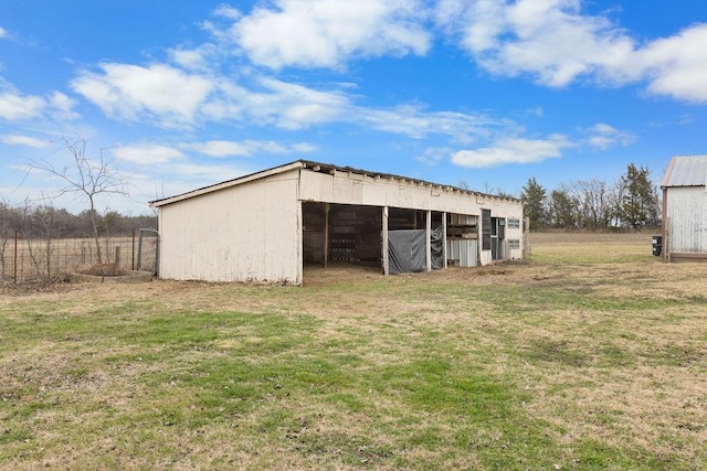 view of outbuilding with a lawn