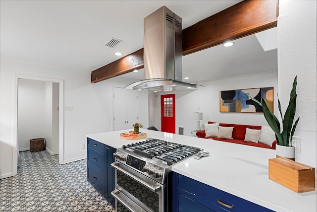 kitchen with blue cabinetry, island exhaust hood, beam ceiling, and stainless steel gas stove