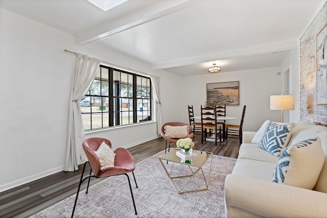 living room with beamed ceiling and hardwood / wood-style flooring