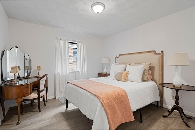 bedroom with wood-type flooring