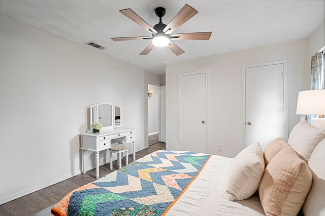 bedroom with dark wood-type flooring and ceiling fan
