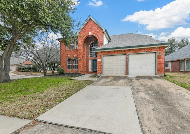 front facade featuring a garage and a front yard