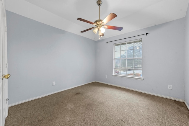 unfurnished room with ceiling fan and carpet flooring