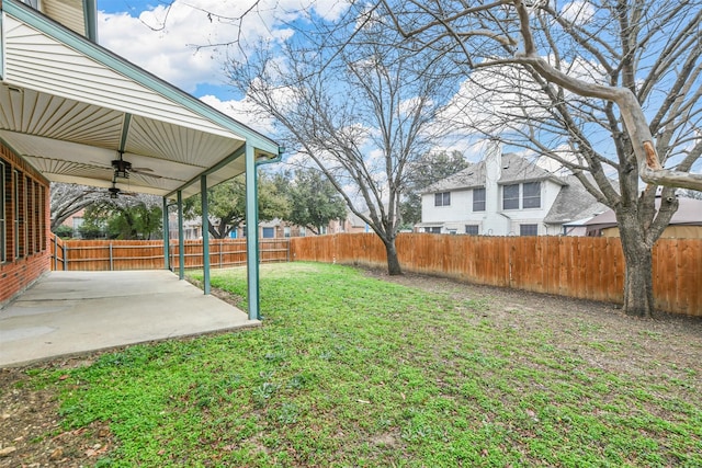 view of yard featuring a patio and ceiling fan