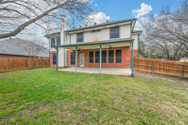 back of house featuring ceiling fan, a yard, and a patio