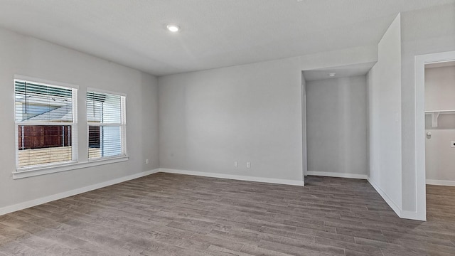 spare room with hardwood / wood-style floors