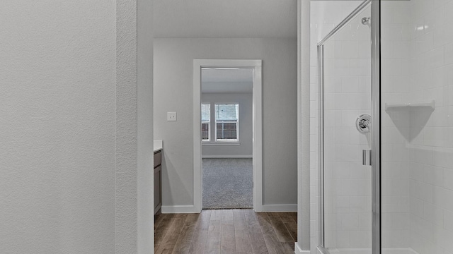 hallway featuring dark hardwood / wood-style floors