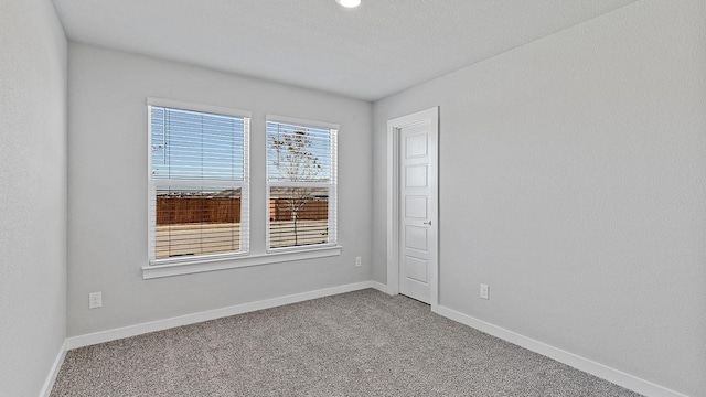 empty room with carpet flooring