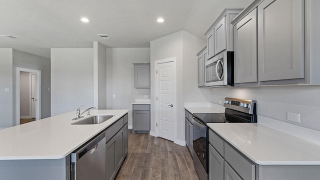 kitchen with stainless steel appliances, sink, and gray cabinets