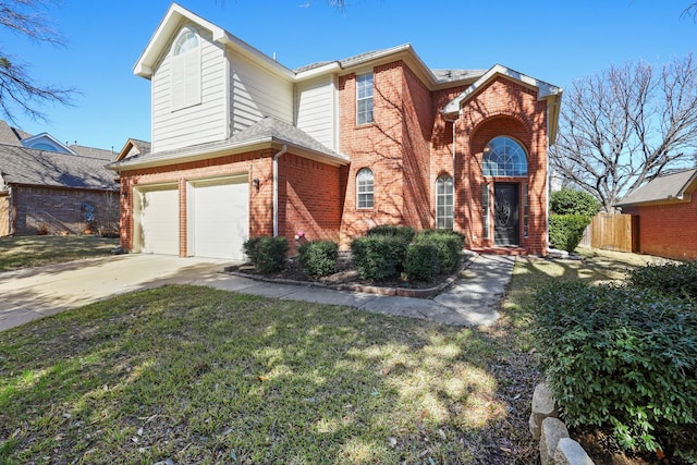 view of property featuring a garage and a front lawn