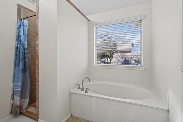 bathroom with shower with separate bathtub