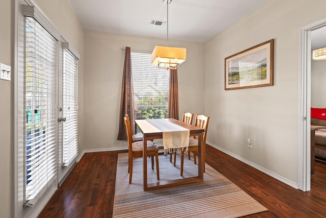 dining area featuring dark hardwood / wood-style flooring