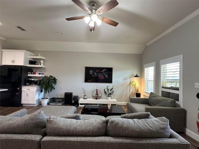 living room with crown molding, ceiling fan, lofted ceiling, and dark hardwood / wood-style flooring