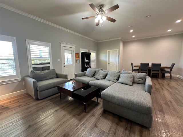 living room featuring crown molding, hardwood / wood-style floors, and ceiling fan