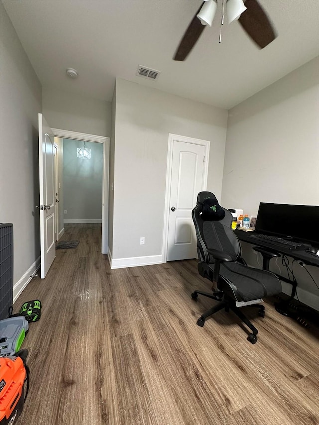 office space featuring hardwood / wood-style floors and ceiling fan