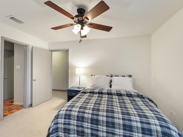 carpeted bedroom featuring ceiling fan