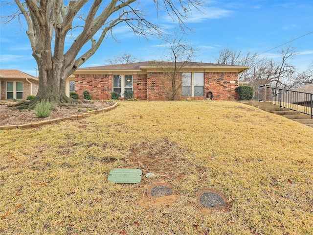 back of house featuring a lawn