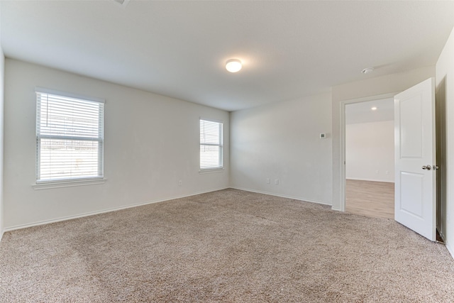 empty room with light colored carpet