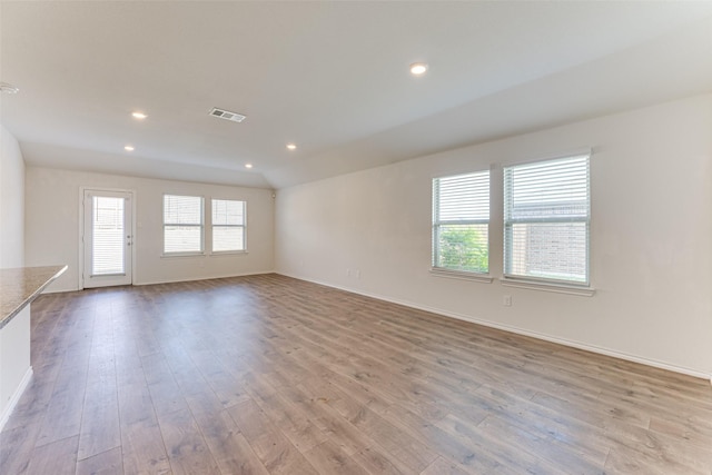 unfurnished room with plenty of natural light and light wood-type flooring