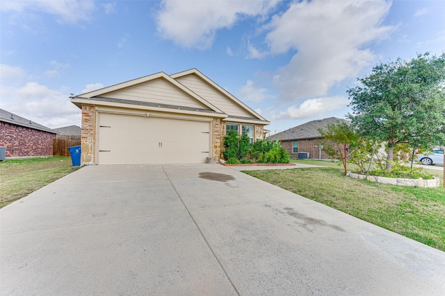 view of front of home with a garage, central AC unit, and a front yard