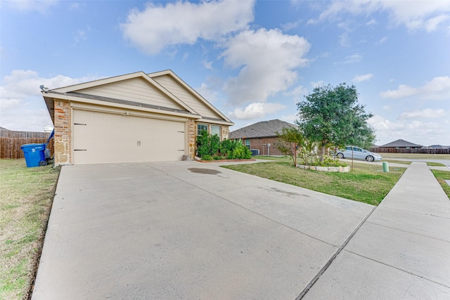 view of front facade with a garage and a front yard