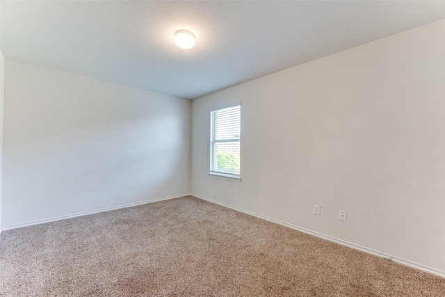 unfurnished room with carpet floors