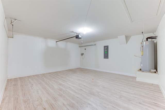 basement with water heater, electric panel, and light wood-type flooring