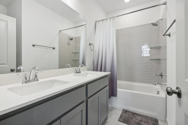 bathroom with double vanity, a sink, and shower / bath combo with shower curtain