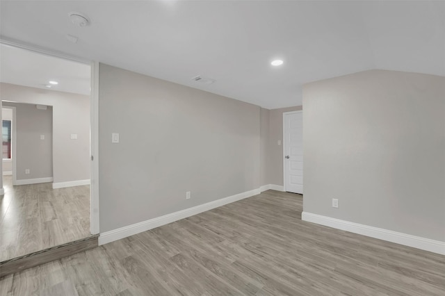 empty room with light hardwood / wood-style flooring