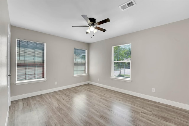 unfurnished room featuring ceiling fan and light wood-type flooring