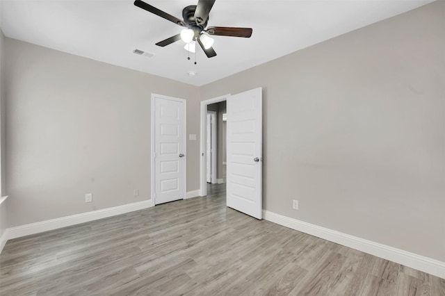 unfurnished bedroom featuring ceiling fan and light hardwood / wood-style floors