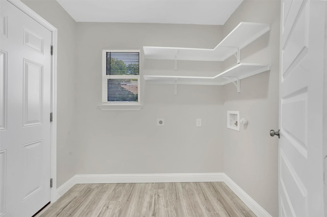 laundry area featuring hookup for an electric dryer, washer hookup, and light hardwood / wood-style floors