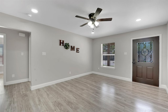 interior space featuring ceiling fan and light wood-type flooring