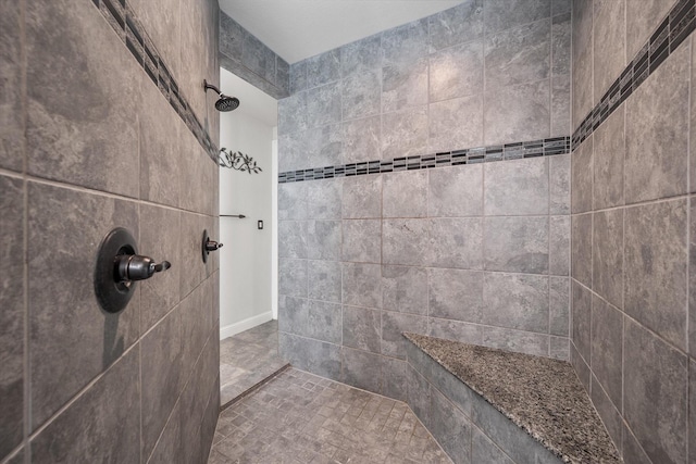 bathroom featuring tiled shower