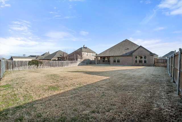 view of yard featuring a patio and a fenced backyard