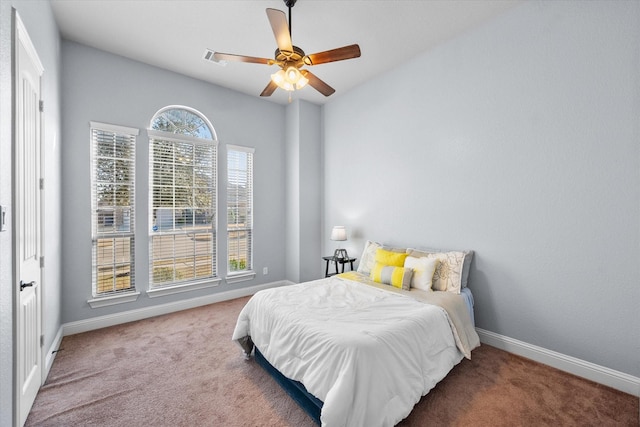 bedroom with ceiling fan and carpet flooring