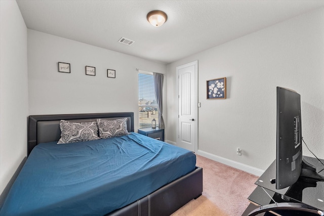 bedroom featuring carpet flooring, baseboards, and visible vents