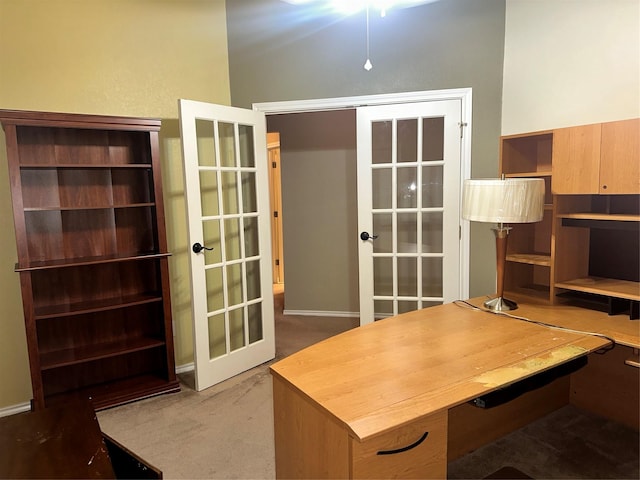 carpeted office featuring french doors