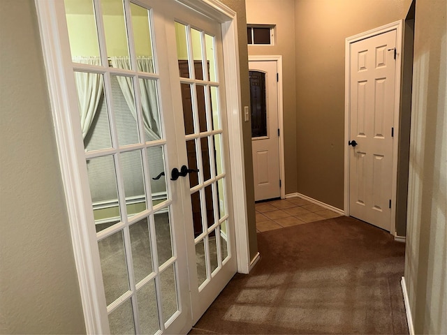 hall featuring french doors and carpet floors