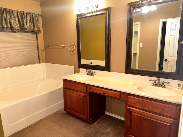 bathroom with a washtub and vanity