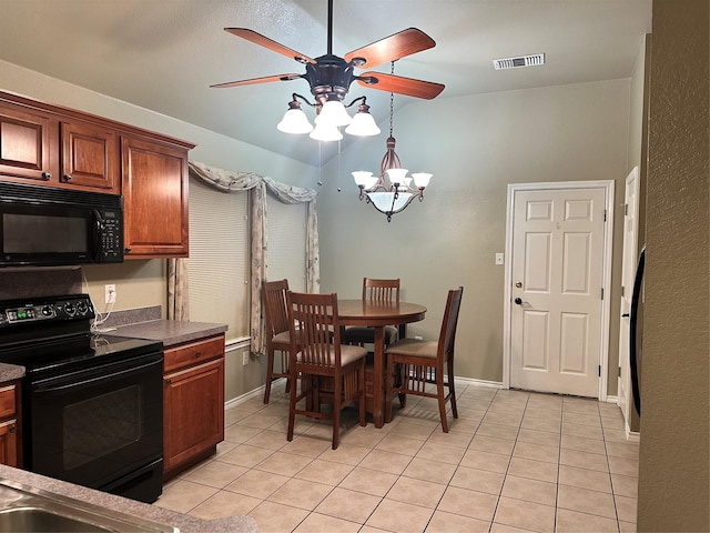 tiled dining room with ceiling fan with notable chandelier