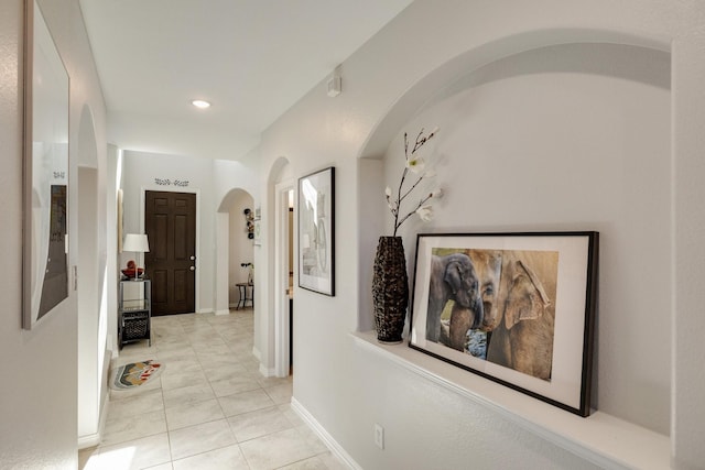 hallway with light tile patterned floors