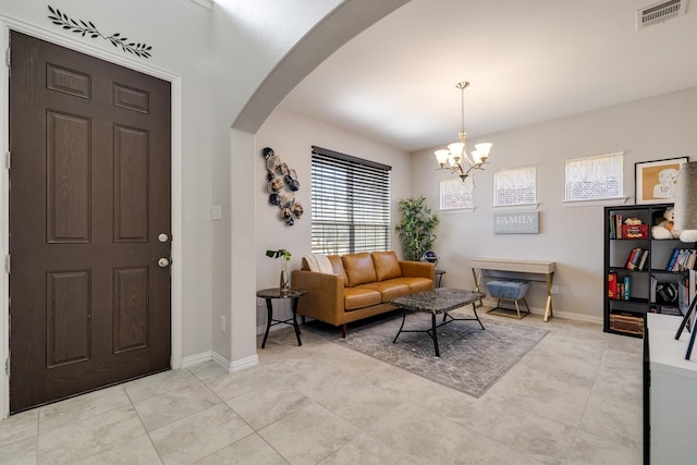 living room with an inviting chandelier