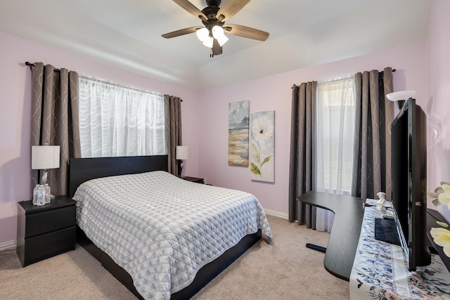 bedroom featuring ceiling fan and light carpet