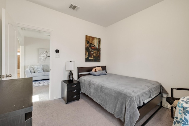 bedroom featuring light carpet