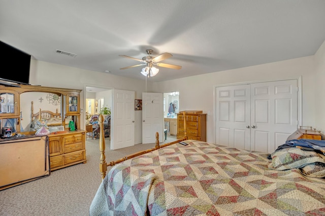 bedroom with carpet, ceiling fan, and a closet