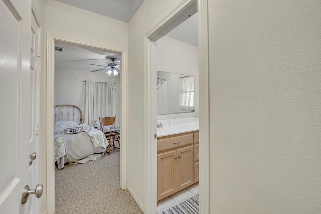 hallway with light colored carpet